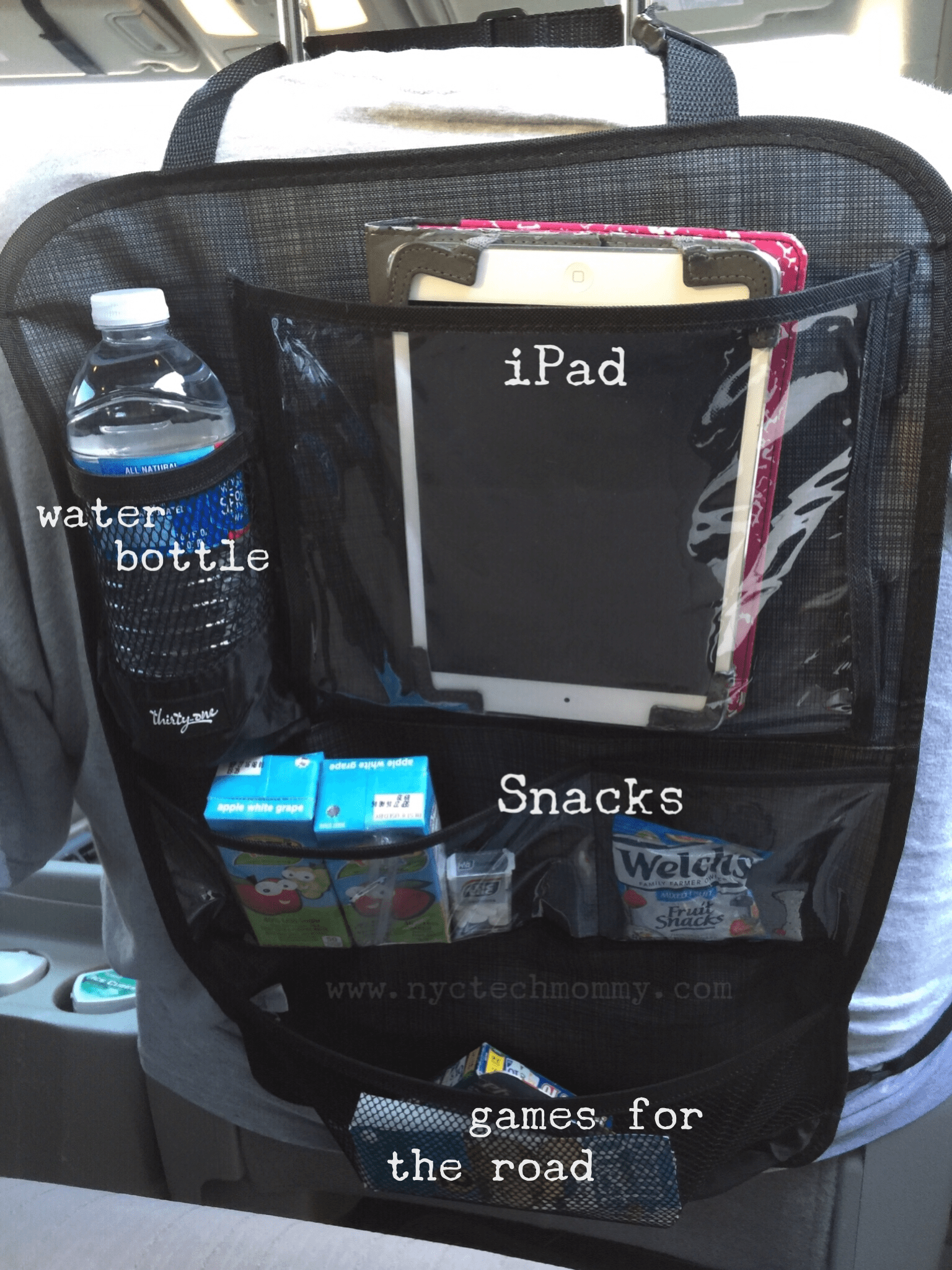 The Hang Up Activity Organizer from Thirty-One - Hangs neatly behind your car seat and helps keep all of your kid's stuff organized and within arms length. No more nagging and asking for snacks during long road trips!