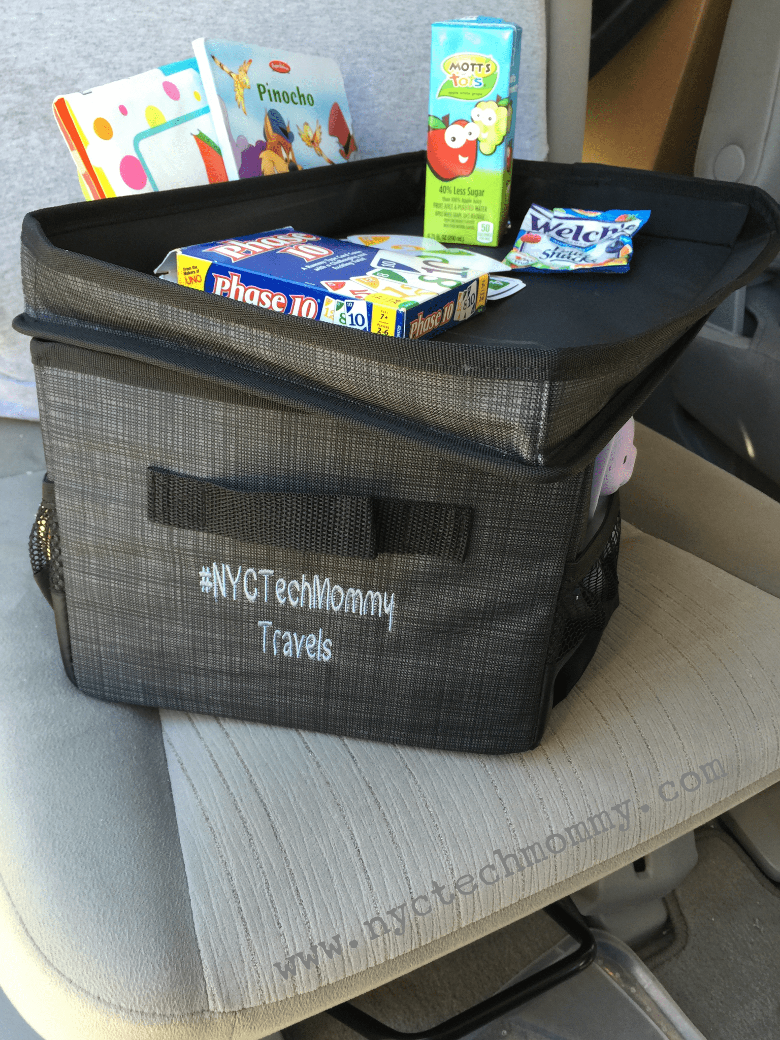 The Flip-Top Organizing Bin from Thirty-One is the perfect place to store all of your kids stuff, toys, snacks, a change of clothes, and more. The top doubles as a table when on the go. Check out my other tips for getting your car and kids organized. Click now!