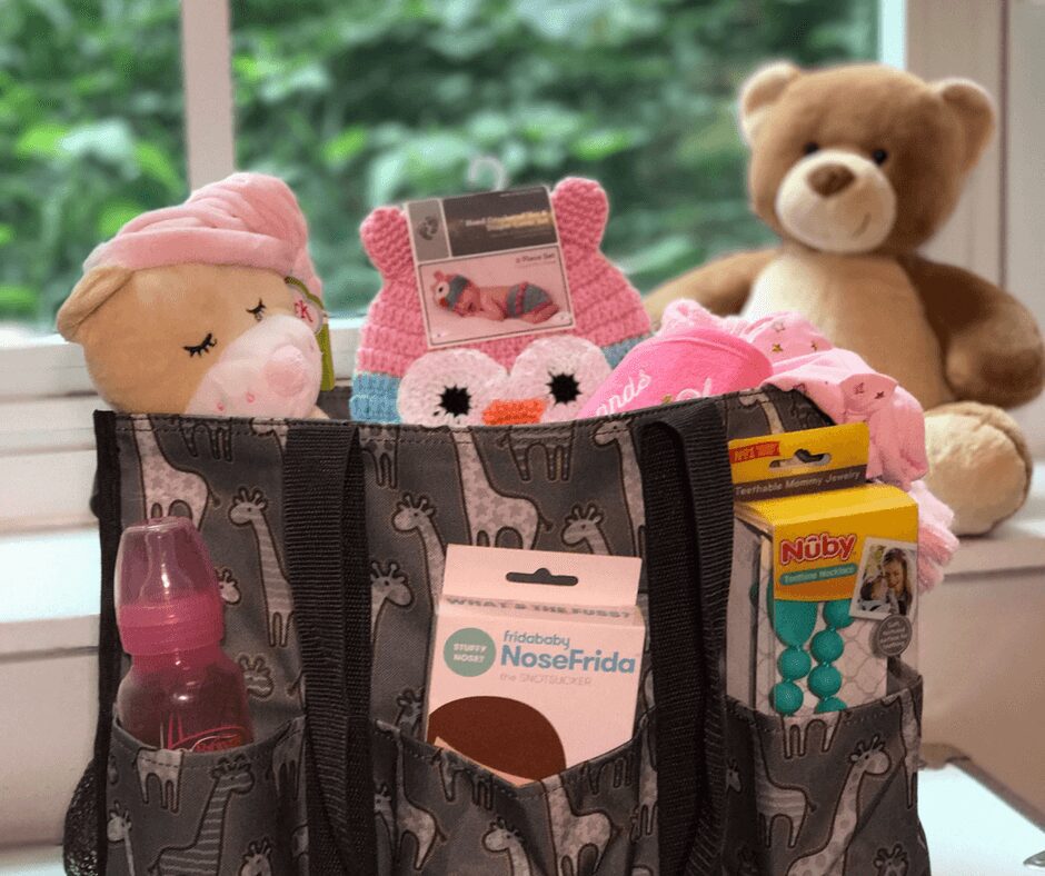 Baby Shower Gift Idea -- Stuff all your favorite baby essentials into an adorable Thirty-One bag for baby